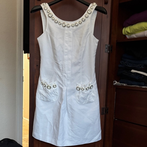 Dolce & Gabbana Dresses & Skirts - Elegant White Sleeveless Dress with Whimsical Button Detailing